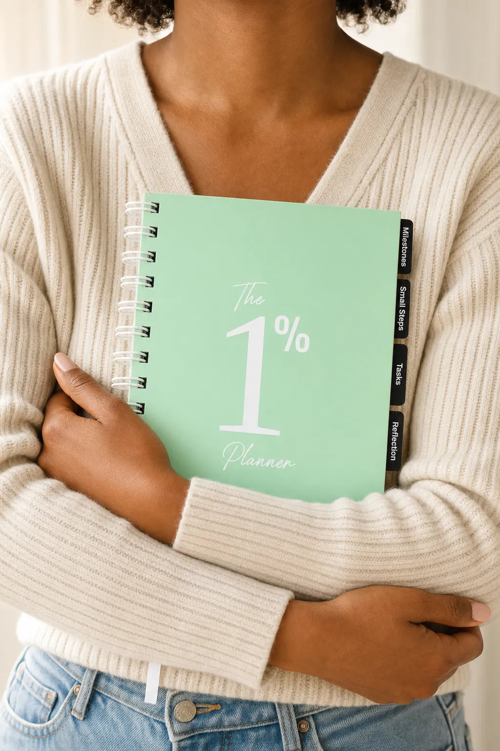 Holding The 1% Planner close